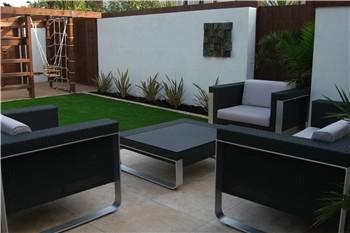 Stylish seating and wall art, with play area in the background